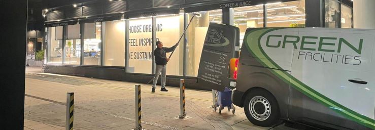 Green-FM-van-operative-cleaning-windows-1